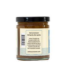 Load image into Gallery viewer, Side of view of caramel sauce jar with description of Jonboy Boy Caramel company info. "Best served warm. Refrigerate after opening."
